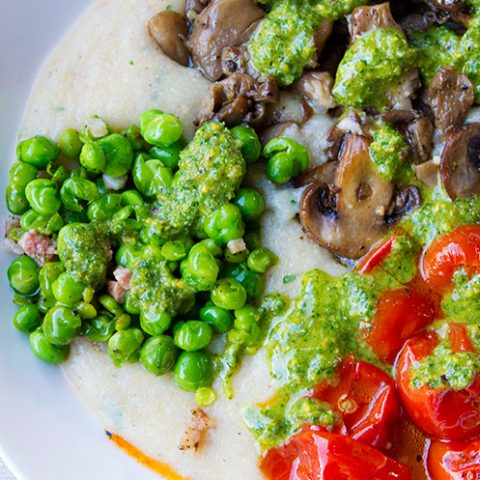 Herbed Farro Polenta Topped With Veggies & Celery Leaf Pistachio Pesto